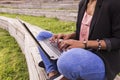 Close up view of a young afro American woman using laptop. Green