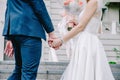 Close up view of young bride and groom holding hands sceen outdoor Royalty Free Stock Photo