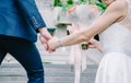 Close up view of young bride and groom holding hands sceen outdoor Royalty Free Stock Photo