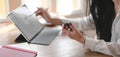 Close-up view of young businesswoman working on her project with blank screen digital tablet Royalty Free Stock Photo