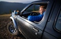 Off-road riding on black car in the mountains. Royalty Free Stock Photo