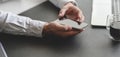 Close-up view of young professional businessman using smartphone Royalty Free Stock Photo