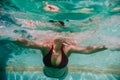 Close up view of young woman diving underwater in a pool. summer and fun lifestyle Royalty Free Stock Photo