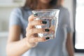 Close up view of young woman drinking pure mineral water in a glass Royalty Free Stock Photo