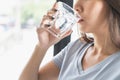 Close up view of woman drinking pure mineral water in a glass Royalty Free Stock Photo