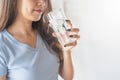 Close up view of young woman drinking pure mineral water in a glass.pp Royalty Free Stock Photo