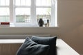 Close up vignette of cushions and window objects in luxury apar