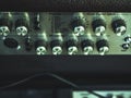 Close up vintage audio rig control with knobs, faders