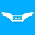 Close up of vintage audio tape cassette with angel wings concept illustration on blue background