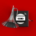 Close up of vintage audio tape cassette with gramophone concept illustration on red background Royalty Free Stock Photo