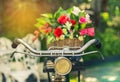 Close up vintage bicycle with bouquet flowers in basket Royalty Free Stock Photo