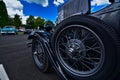 Close up of a vintage black Ford with spare wire wheel