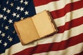 Open vintage book on old US American flag Royalty Free Stock Photo