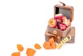 Close up of vintage boxes with orange flowers on white background.