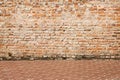 Vintage brick wall texture in horizontal patterns with pavement for background Royalty Free Stock Photo