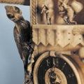 Wooden carved woodpecker on grandfather clock 3d rendering