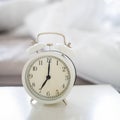 Close up vintage clock in the bedroom 7am , 7oclock in the morning. Royalty Free Stock Photo