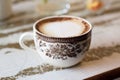 Close up vintage cup of coffee rose motive Royalty Free Stock Photo
