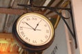 Close up of vintage death clock hang on the vintage zinc roof at vintage train station in province of Asia. Royalty Free Stock Photo
