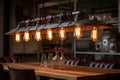 close-up of vintage industrial lighting hanging over a reclaimed wood dining table