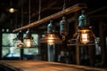 close-up of vintage industrial lighting hanging over a reclaimed wood dining table