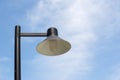 Close up vintage lamp and pole in the garden park and blie sky background. Electrical light in the night. Royalty Free Stock Photo