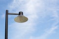Close up vintage lamp and pole in the garden park and blie sky background. Electrical light in the night. Royalty Free Stock Photo