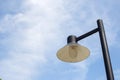 Close up vintage lamp and pole in the garden park and blie sky background. Electrical light in the night. Royalty Free Stock Photo