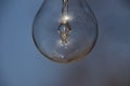 Close up of a vintage lightbulb hanging outdoors with condensation droplets inside Royalty Free Stock Photo