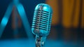 Close Up of a Vintage Metal Microphone with Blue Lighting on Dark Royalty Free Stock Photo