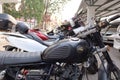 Close-up of vintage motorcycle parked in a public outdoor parking lot