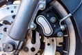 Close up of Vintage motorcycle parking on the road. Croped view, wheel