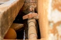 Close-up Vintage Old PVC Pipe with Red Valve on Dirty Concrete Wall - Water Supply Royalty Free Stock Photo