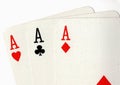 Close up of vintage playing cards showing three aces. Royalty Free Stock Photo