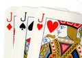 Close up of vintage playing cards showing three jacks. Royalty Free Stock Photo