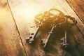 close up of vintage skeleton keys over wooden table Royalty Free Stock Photo