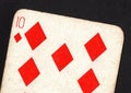 Close up of a vintage ten of diamonds playing card on a black background. Royalty Free Stock Photo