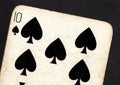 Close up of a vintage ten of spades playing card on a black background. Royalty Free Stock Photo