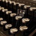 Close-up of a vintage typewriter keyboard showcasing round, metallic keys with raised