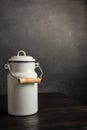 Close up of vintage white milk jug on dark wooden table Royalty Free Stock Photo