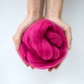 Close-up of violet merino wool ball in hands Royalty Free Stock Photo