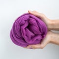 Close-up of violet merino wool ball in hands Royalty Free Stock Photo