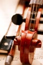 Close Up of Violin Scroll and Bow Royalty Free Stock Photo