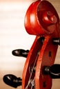 Close Up of Violin Scroll in front of Sheet Music Royalty Free Stock Photo