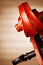 Close Up of Violin Scroll in front of Sheet Music Royalty Free Stock Photo