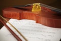 Close up of violin standing on music sheet. 3D illustration Royalty Free Stock Photo