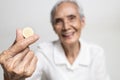 Close up of vitamin C tablets,dietary supplement in hands of elderly,medicine drug for immunity,asian senior woman holding calcium Royalty Free Stock Photo