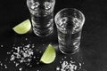 Close up vodka in shot glass on black background