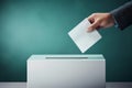 Close-up of voter putting ballot into a white election box on turquoise background