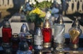 Close up of Votive candles lantern on the grave in Slovak Catholic cemetery during day. Autumn scene. All Hallows eve. Memorial Royalty Free Stock Photo